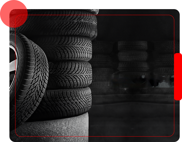A stack of tires in front of some other tires.